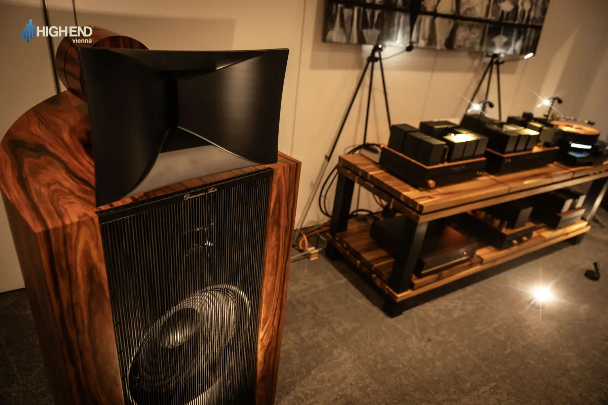 A Destination Audio horn speaker and a rack of tube amplifiers and a turntable in the High End Vienna room
