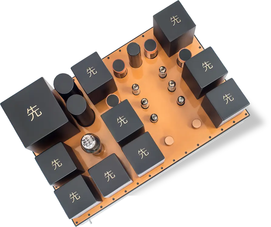 Top view of a Destination Audio tube component with black transformer housings and vacuum tubes on a copper-colored plate